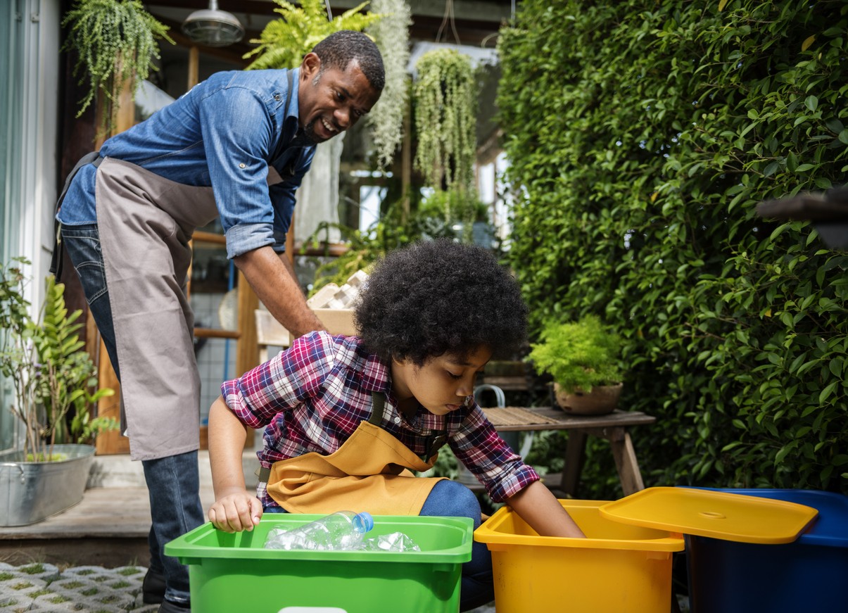 African Descent Kid Separating Recyclable Trash